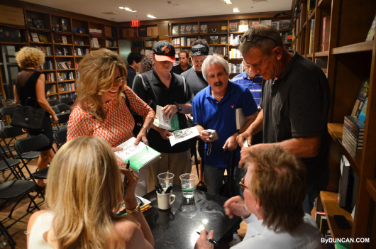 Lining up to get their books signed.